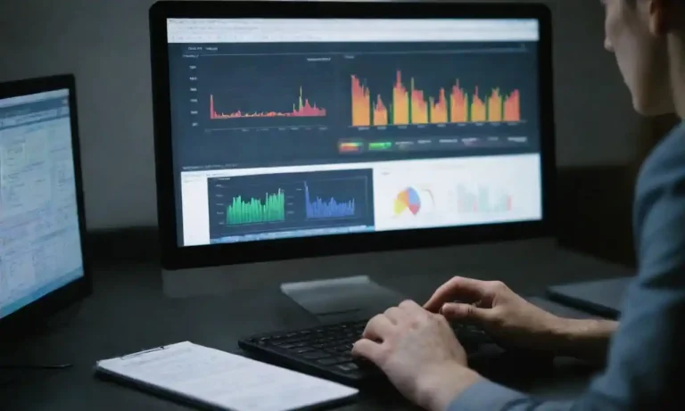 Person analyzing marketing data on a computer with charts and reports.