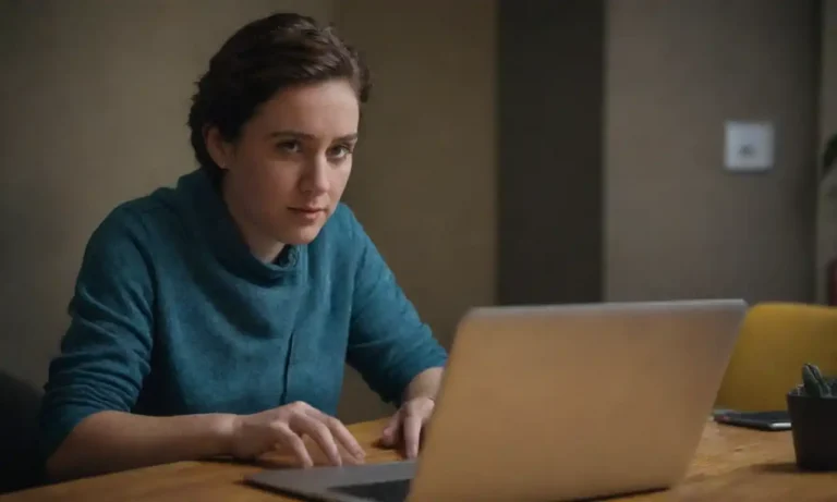 A marketer engaging with followers on a laptop