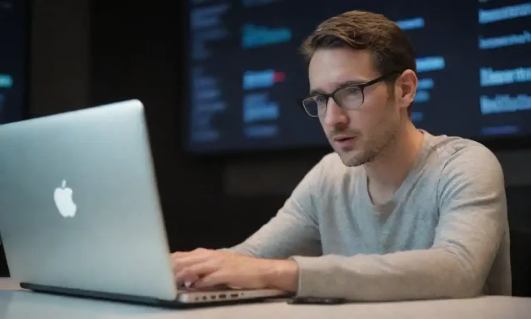 A marketer analyzing social media data and insights on a laptop.