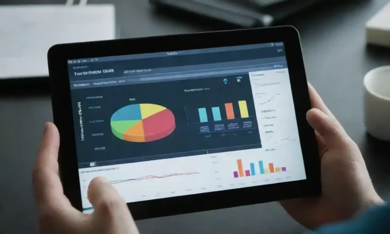 Person analyzing data trends on a digital tablet