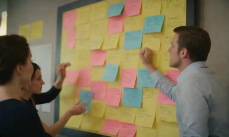 A team brainstorming with Post-it notes and a brand strategy board.