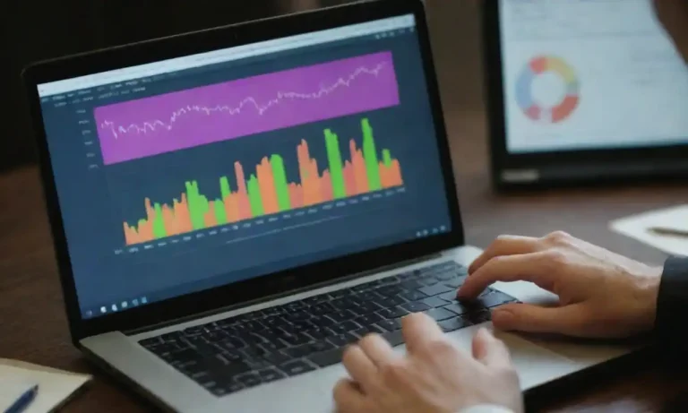 Person analyzing marketing data on a laptop with charts and graphs displayed.